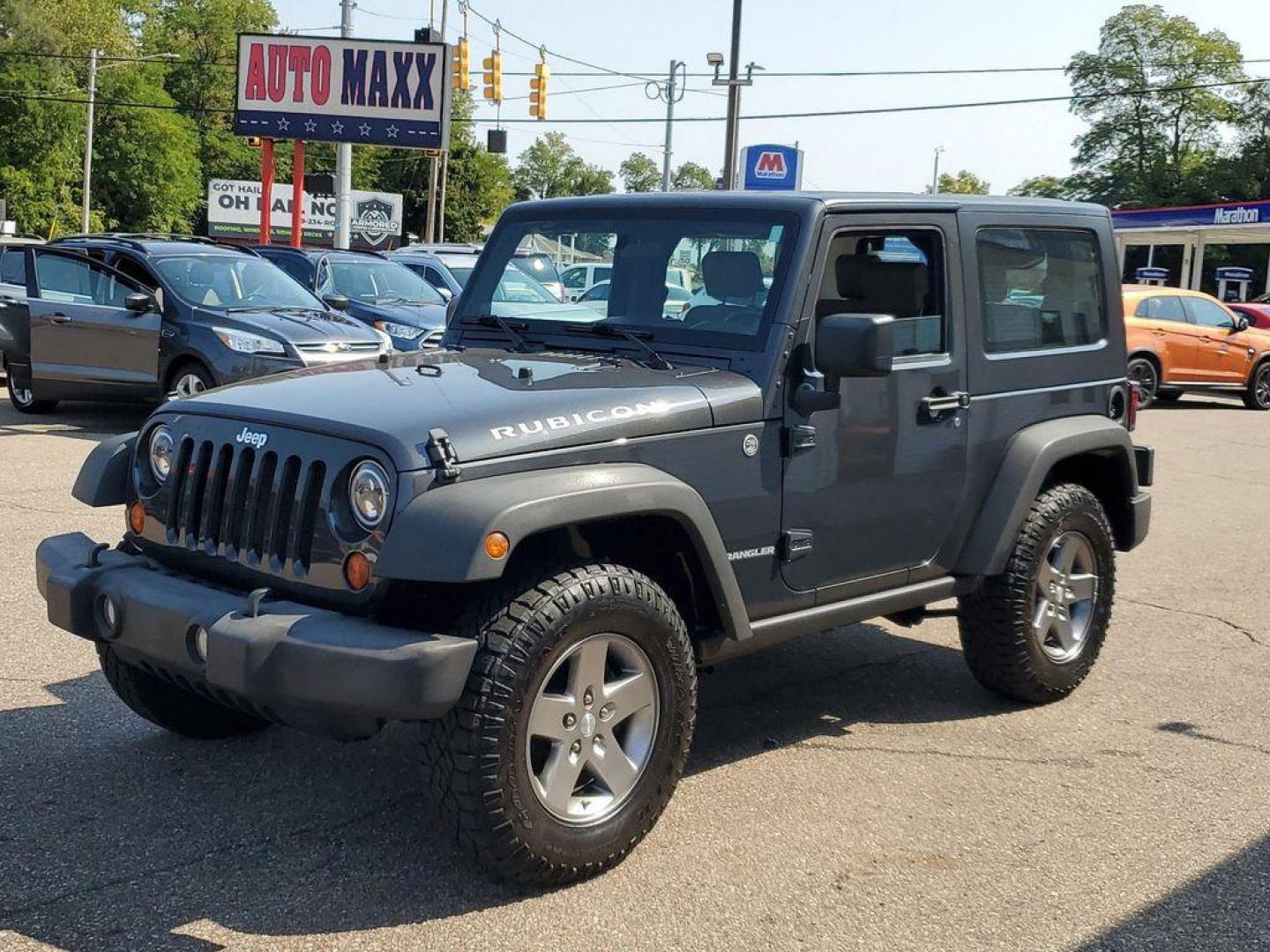 2010 Gray /Dark Khaki/Medium Khaki Jeep Wrangler Rubicon 4WD (1J4BA6D15AL) with an 3.8L V6 OHV 12V engine, 4-speed automatic transmission, located at 234 Columbia Ave, Battle Creek, MI, 49015, (269) 222-0088, 42.298264, -85.192543 - <b>Vehicle Details</b><br>Introducing a robust and reliable 2010 Jeep Wrangler Rubicon, now available at our dealership. This exceptional vehicle boasts a powerful V6, 3.8L engine and a dependable 4WD system, making it the ideal choice for both off-road adventures and daily commutes. The Wrangler Ru - Photo#3