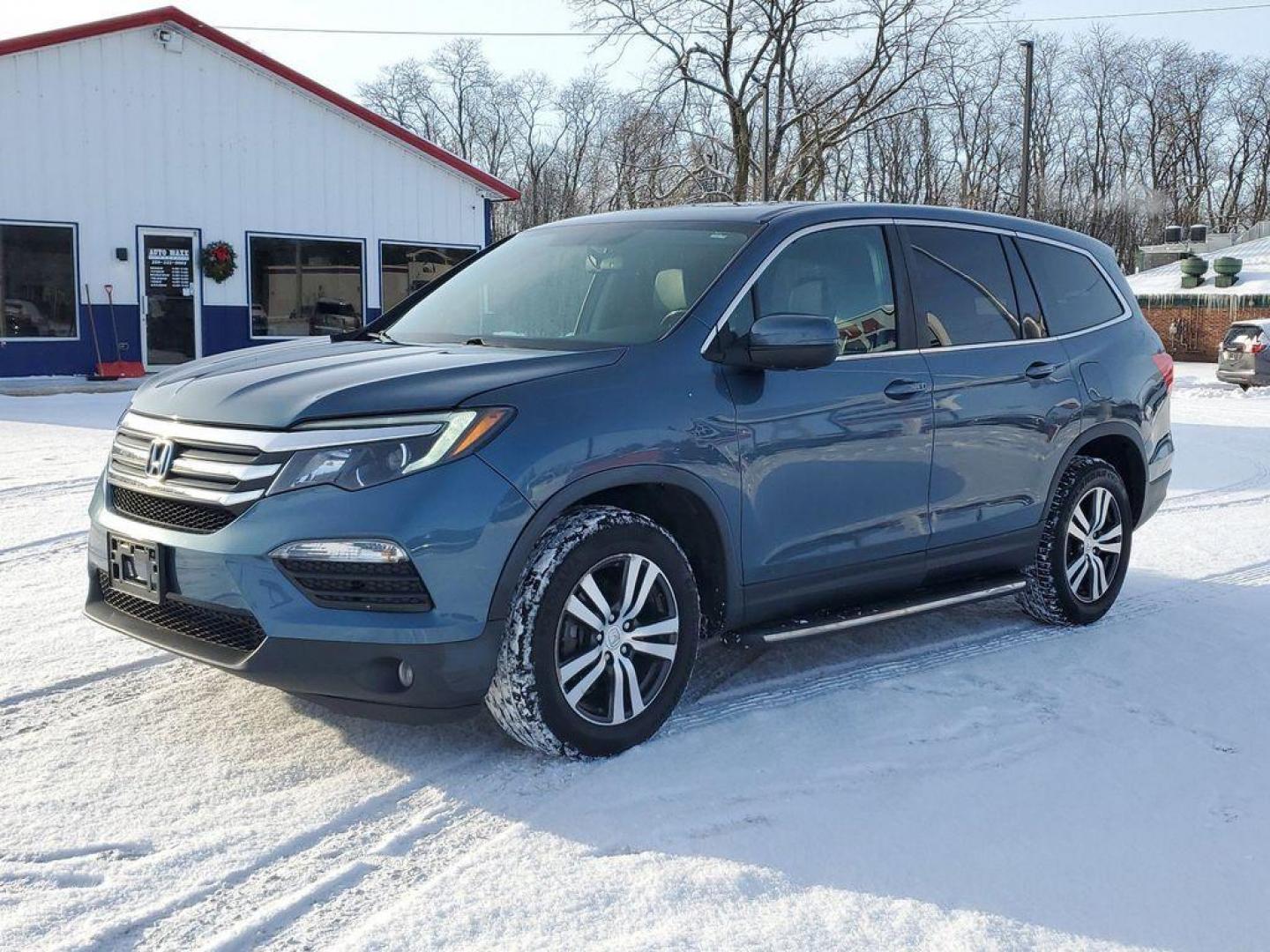 2016 Steel Sapphire Metallic /Beige Honda Pilot EXL 4WD (5FNYF6H56GB) with an 3.5L V6 SOHC 24V engine, 6-Speed Automatic transmission, located at 6064 Gull Rd, Kalamazoo, MI, 49048, (269) 222-0088, 42.328388, -85.512924 - Introducing the impeccable 2016 Honda Pilot EX-L, a remarkable SUV that stands out with its perfect blend of style, performance, and luxury. This vehicle is a pristine gem with 0 miles, ready to embark on countless adventures with its new owner. Under the hood, you'll find a robust V6, 3.5L engine t - Photo#1