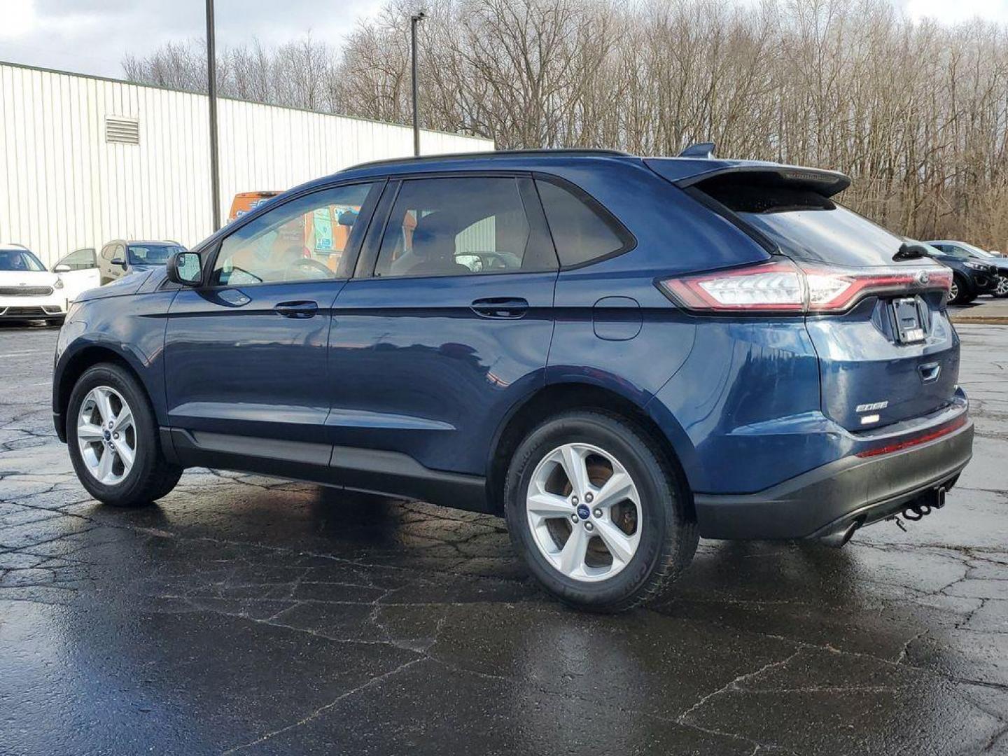 2017 Blue Jeans Metallic /Ebony Ford Edge SE AWD (2FMPK4G93HB) with an 2.0L L4 DOHC 16V engine, 6A transmission, located at 6064 Gull Rd, Kalamazoo, MI, 49048, (269) 222-0088, 42.328388, -85.512924 - Introducing the 2017 Ford Edge SE with All-Wheel Drive, a robust and stylish SUV designed to meet the demands of both city driving and weekend adventures. This model is powered by a fuel-efficient 4-cylinder, 2.0L EcoBoost engine, ensuring a dynamic yet economical driving experience. <br><br>Meticul - Photo#2