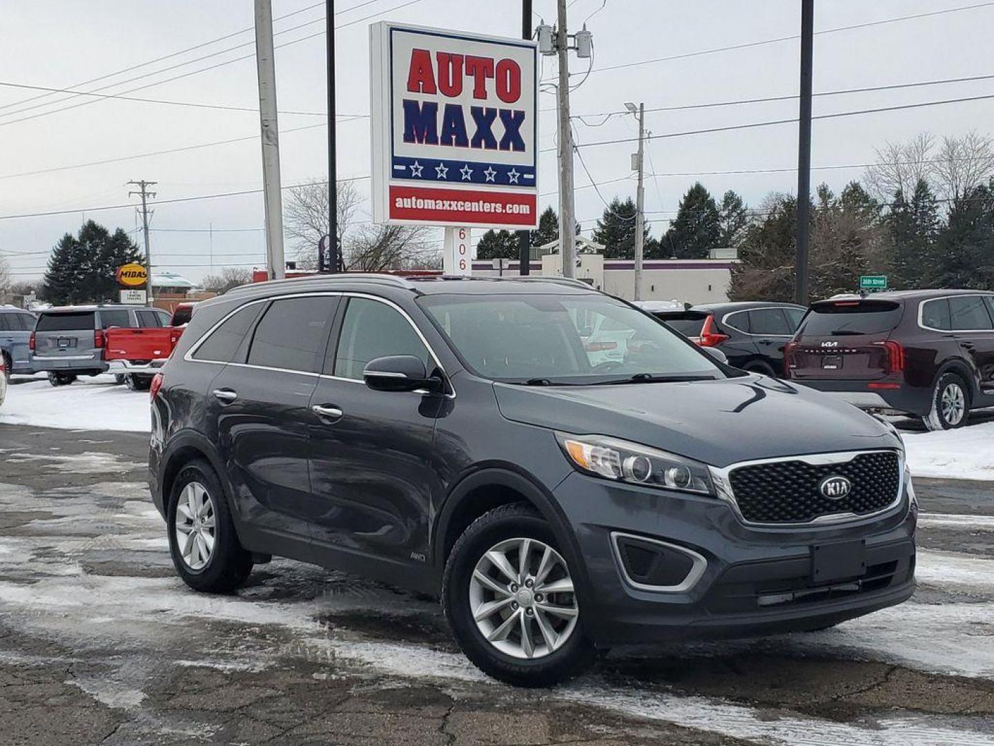 2017 Platinum Graphite /Satin Black Kia Sorento LX AWD (5XYPGDA31HG) with an 2.4L L4 DOHC 16V engine, 6A transmission, located at 6064 Gull Rd, Kalamazoo, MI, 49048, (269) 222-0088, 42.328388, -85.512924 - <b>Summary</b><br>Power Moonroof LEATHER<br><br><b>Vehicle Details</b><br>Discover the exceptional reliability and versatility of the 2017 Kia Sorento LX AWD, a perfect blend of performance and practicality. Equipped with a fuel-efficient 2.4L 4-cylinder engine, this Kia Sorento delivers a smooth an - Photo#0