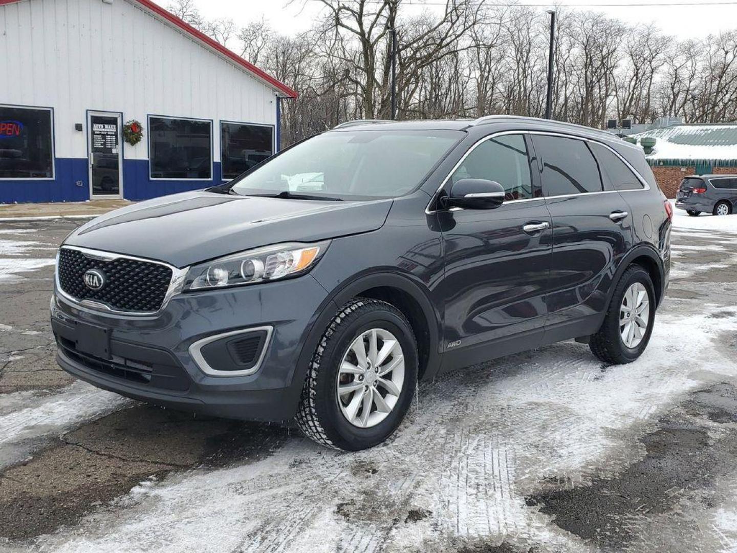 2017 Platinum Graphite /Satin Black Kia Sorento LX AWD (5XYPGDA31HG) with an 2.4L L4 DOHC 16V engine, 6A transmission, located at 6064 Gull Rd, Kalamazoo, MI, 49048, (269) 222-0088, 42.328388, -85.512924 - <b>Summary</b><br>Power Moonroof LEATHER<br><br><b>Vehicle Details</b><br>Discover the exceptional reliability and versatility of the 2017 Kia Sorento LX AWD, a perfect blend of performance and practicality. Equipped with a fuel-efficient 2.4L 4-cylinder engine, this Kia Sorento delivers a smooth an - Photo#1