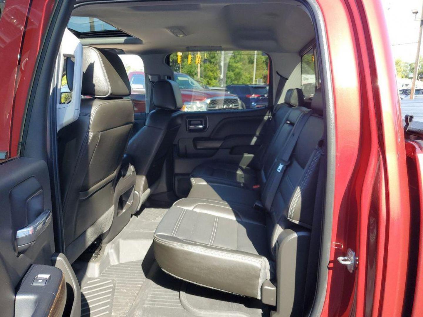 2018 Red Quartz Tintcoat /Jet Black GMC Sierra 1500 Denali Crew Cab Long Box 4WD (3GTU2PEJ9JG) with an 6.2L V8 OHV 16V engine, 6A transmission, located at 234 Columbia Ave, Battle Creek, MI, 49015, (269) 222-0088, 42.298264, -85.192543 - <b>Vehicle Details</b><br>Discover the power and luxury of the 2018 GMC Sierra 1500 Denali at our dealership. This pre-owned gem comes equipped with a robust V8, 6.2L engine and 4WD, ensuring you have the muscle and traction needed for any adventure or tough job. Step inside to experience true com - Photo#27