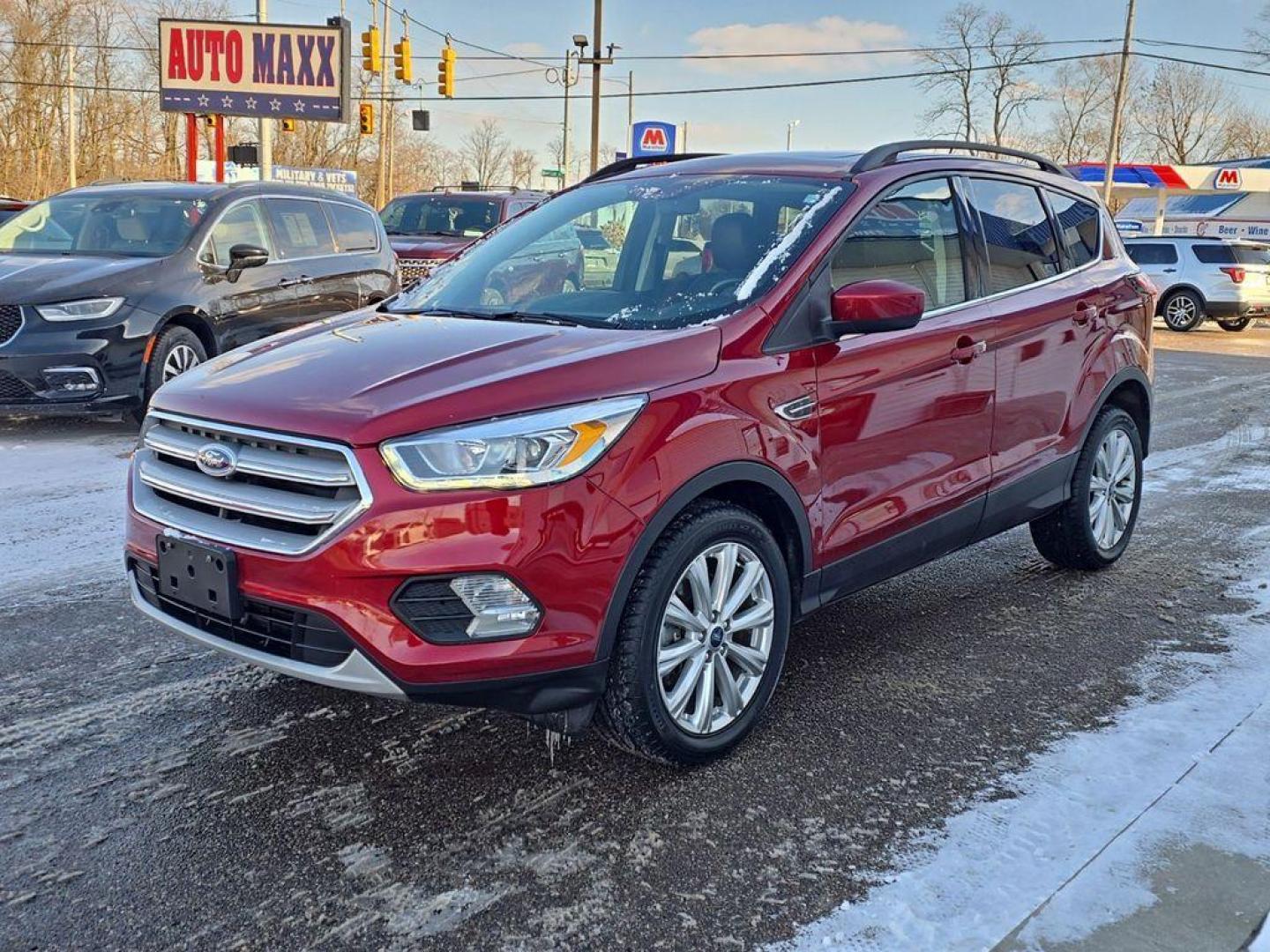 2019 Ruby Red Metallic Tinted Clearcoat /Charcoal Black Ford Escape SEL 4WD (1FMCU9HD2KU) with an 1.5L L4 DOHC 16V engine, 6A transmission, located at 234 Columbia Ave, Battle Creek, MI, 49015, (269) 222-0088, 42.298264, -85.192543 - When you encounter slick or muddy roads, you can engage the four wheel drive on the Ford Escape and drive with confidence. This small suv comes equipped with Android Auto for seamless smartphone integration on the road. Apple CarPlay: Seamless smartphone integration for this vehicle - stay connected - Photo#1