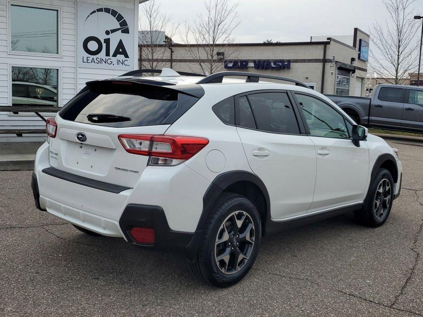 2019 Crystal White Pearl /Black w/Orange Stitching Subaru Crosstrek 2.0i Premium CVT (JF2GTACC8KH) with an 2.0L L4 DOHC 16V engine, CVT transmission, located at 234 Columbia Ave, Battle Creek, MI, 49015, (269) 222-0088, 42.298264, -85.192543 - <b>Vehicle Details</b><br>Get ready to explore the road less traveled with this stunning 2019 Subaru Crosstrek Premium! Perfectly blending adventure-ready capability with everyday practicality, this versatile SUV is your ticket to freedom. Equipped with Subarus legendary All-Wheel Drive, the Crosstr - Photo#1