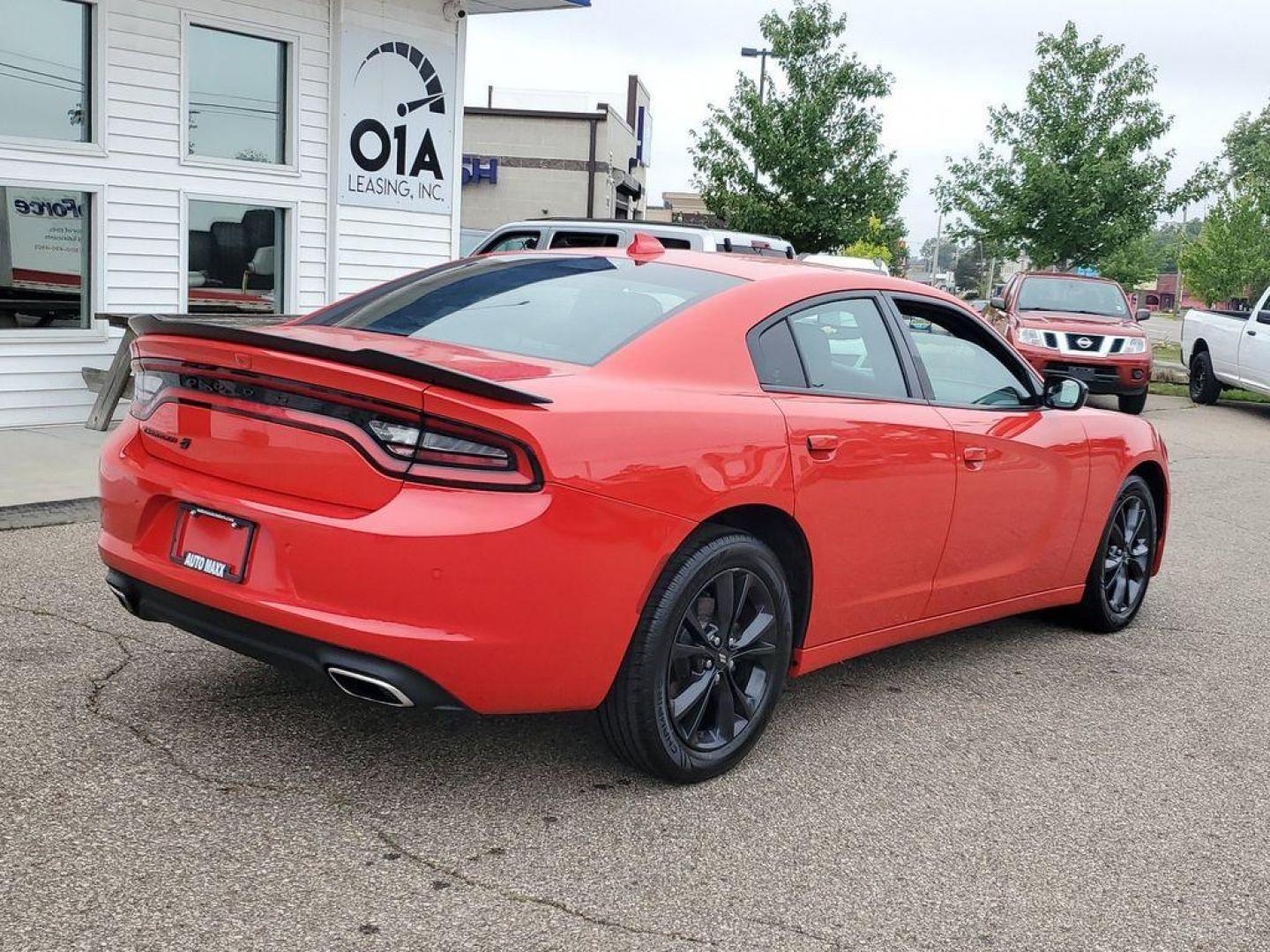 2020 Torred Clearcoat /Black Dodge Charger SXT AWD (2C3CDXJG7LH) with an 3.6L V6 DOHC 24V engine, 8A transmission, located at 234 Columbia Ave, Battle Creek, MI, 49015, (269) 222-0088, 42.298264, -85.192543 - <b>Vehicle Details</b><br>Looking for a dynamic blend of performance and comfort? Check out this 2020 Dodge Charger SXT, equipped with All-Wheel Drive and a powerful V6, 3.6L engine. This standout sedan balances thrilling acceleration with precise handling, making every drive an adventure. Inside, - Photo#1