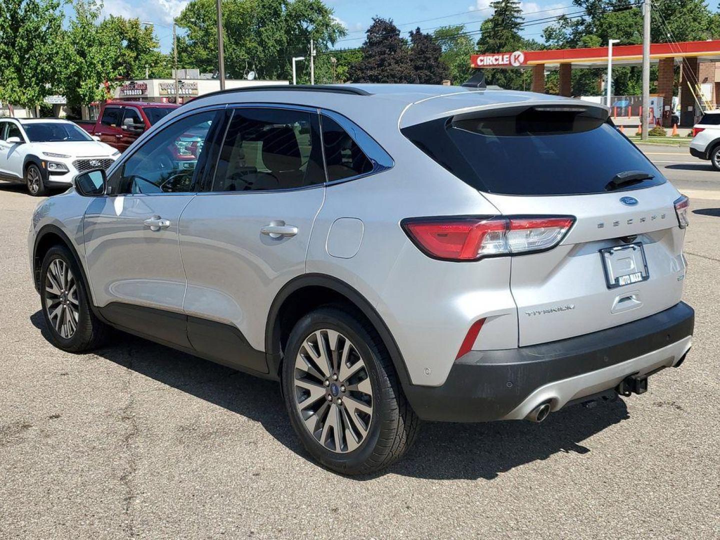 2020 Ingot Silver Metallic /Ebony Black Ford Escape Titanium 4WD (1FMCU9J93LU) with an 2.0L L4 DOHC 16V engine, 6A transmission, located at 234 Columbia Ave, Battle Creek, MI, 49015, (269) 222-0088, 42.298264, -85.192543 - Experience the epitome of sophistication and performance with this 2020 Ford Escape Titanium, designed to elevate your driving experience. This model comes equipped with a robust L4, 2.0L engine, ensuring a powerful yet efficient ride. The advanced 4WD system offers exceptional traction and stabilit - Photo#2