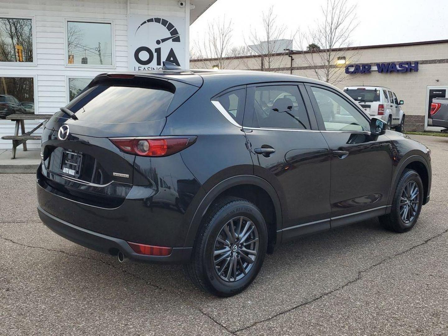 2020 Jet Black Mica /Black Mazda CX-5 Touring AWD (JM3KFBCM9L0) with an 2.5L L4 DOHC 16V engine, 6A transmission, located at 234 Columbia Ave, Battle Creek, MI, 49015, (269) 222-0088, 42.298264, -85.192543 - <b>Vehicle Details</b><br>Introducing the 2020 Mazda CX-5 Touring AWD, a perfect blend of performance, style, and modern technology. This exceptional SUV, powered by a 2.5L 4-cylinder engine, offers a dynamic driving experience with impressive fuel efficiency. The all-wheel-drive system ensures conf - Photo#1