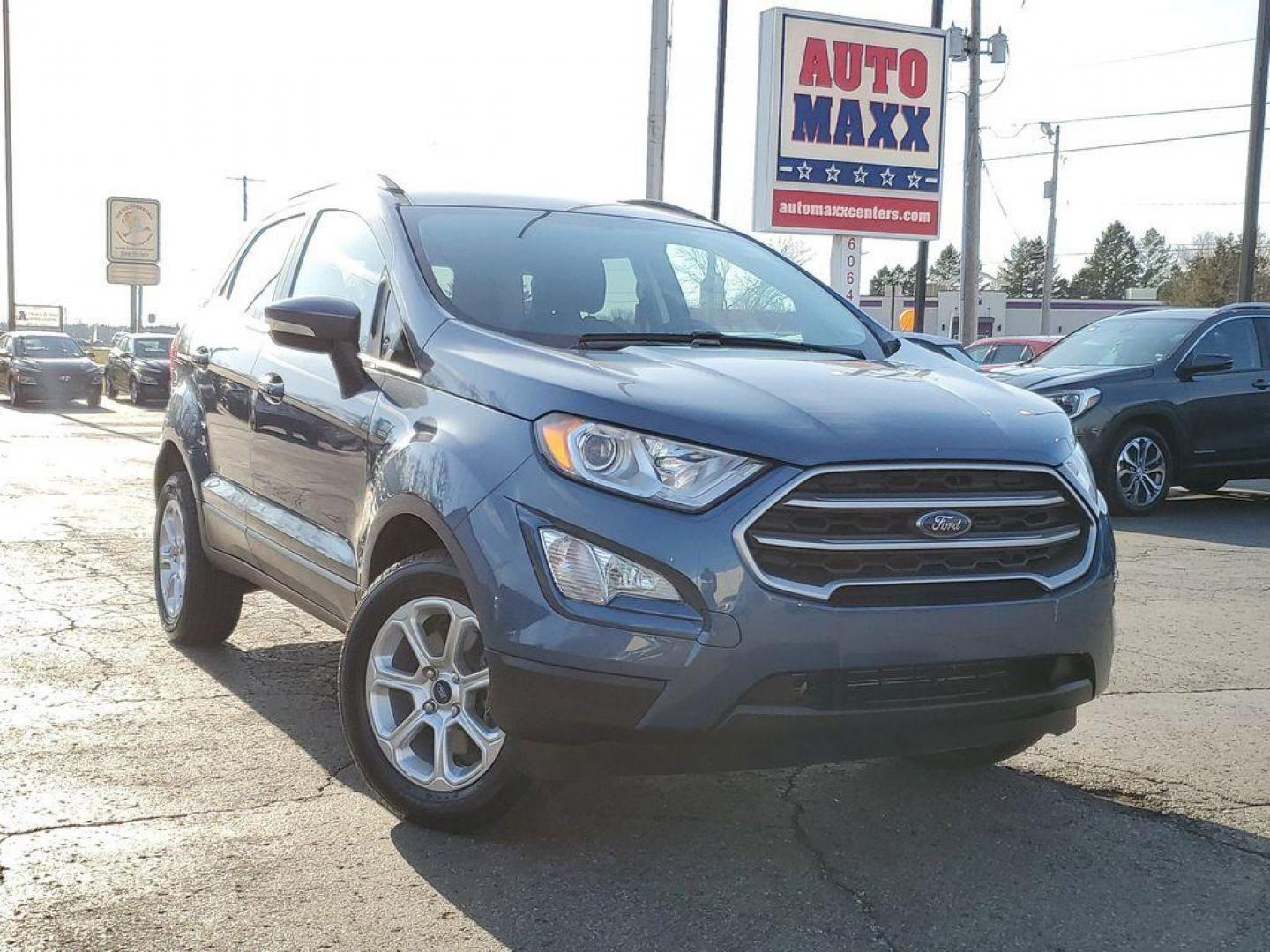 2021 Blue Metallic /Ebony Black Ford EcoSport SE AWD (MAJ6S3GL6MC) with an 2.0L L4 DOHC 16V engine, 6A transmission, located at 234 Columbia Ave, Battle Creek, MI, 49015, (269) 222-0088, 42.298264, -85.192543 - <b>Vehicle Details</b><br>Looking for a reliable and stylish SUV that can handle any terrain? Look no further than this incredible 2021 Ford Ecosport SE! With only 53576 miles on the odometer, this vehicle is practically brand new and ready to hit the road. Equipped with a powerful L4, 2.0L engine - Photo#0