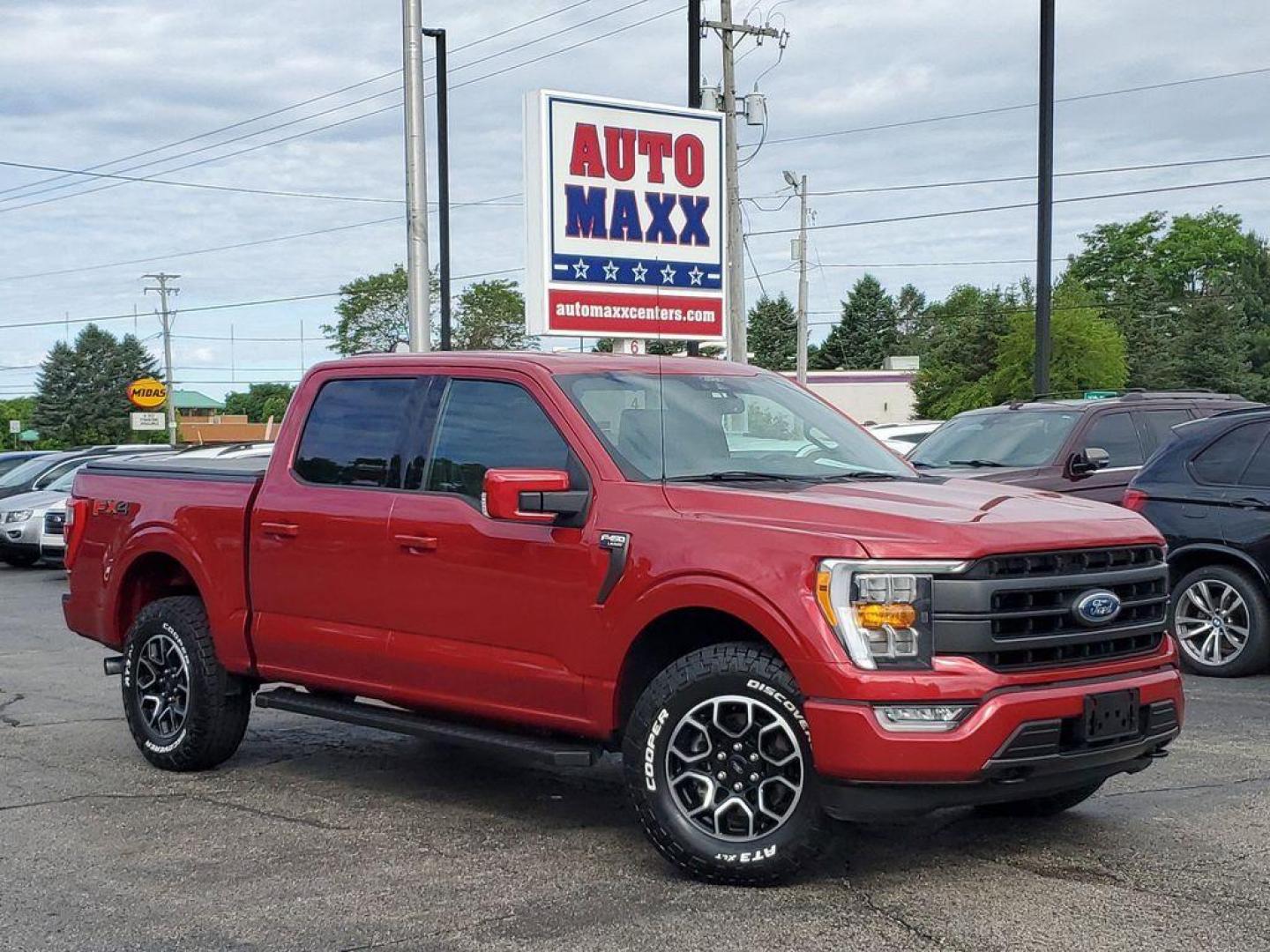 2021 Rapid Red Metallic Tinted Clearcoat /Black Ford F-150 Lariat SuperCrew 5.5-ft. Bed 4WD (1FTFW1E84MK) with an 4.6L V8 SOHC 24V engine, 10-speed automatic transmission, located at 234 Columbia Ave, Battle Creek, MI, 49015, (269) 222-0088, 42.298264, -85.192543 - <b>Vehicle Details</b><br>Experience the perfect blend of power, luxury, and technology with this stunning pre-owned 2021 Ford F-150 LARIAT! This truck is built to impress, featuring a mighty V6, 3.5L engine that delivers robust performance whether you're on the highway or tackling rugged terrain. T - Photo#0