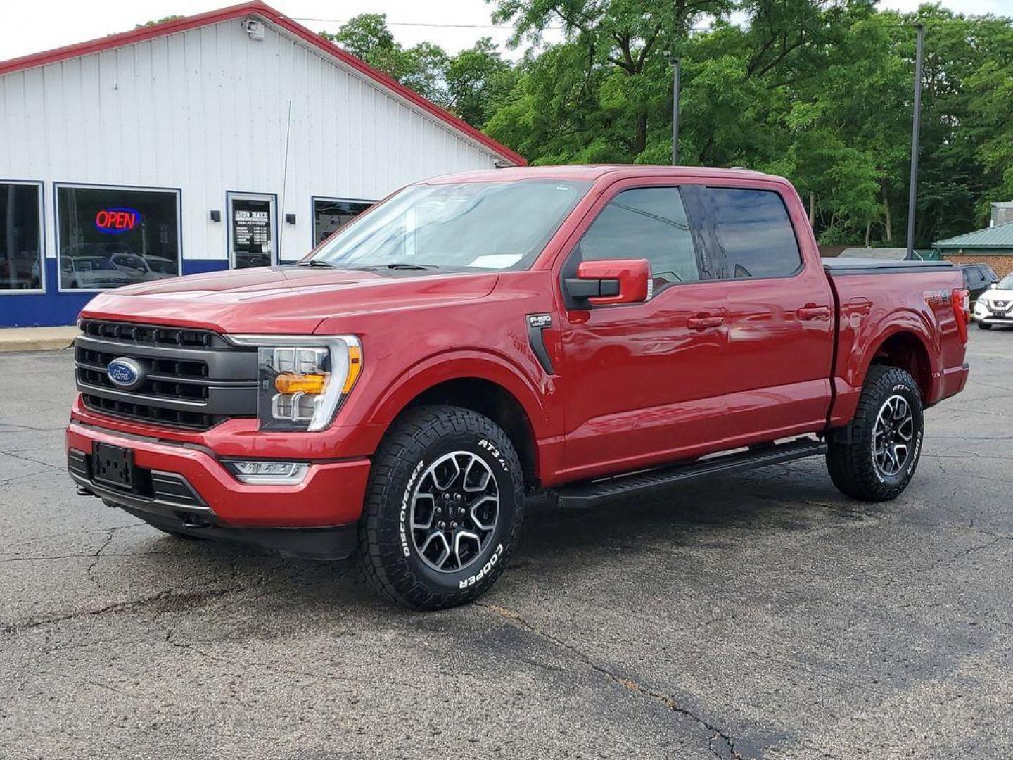 2021 Rapid Red Metallic Tinted Clearcoat /Black Ford F-150 Lariat SuperCrew 5.5-ft. Bed 4WD (1FTFW1E84MK) with an 4.6L V8 SOHC 24V engine, 10-speed automatic transmission, located at 234 Columbia Ave, Battle Creek, MI, 49015, (269) 222-0088, 42.298264, -85.192543 - <b>Vehicle Details</b><br>Experience the perfect blend of power, luxury, and technology with this stunning pre-owned 2021 Ford F-150 LARIAT! This truck is built to impress, featuring a mighty V6, 3.5L engine that delivers robust performance whether you're on the highway or tackling rugged terrain. T - Photo#1