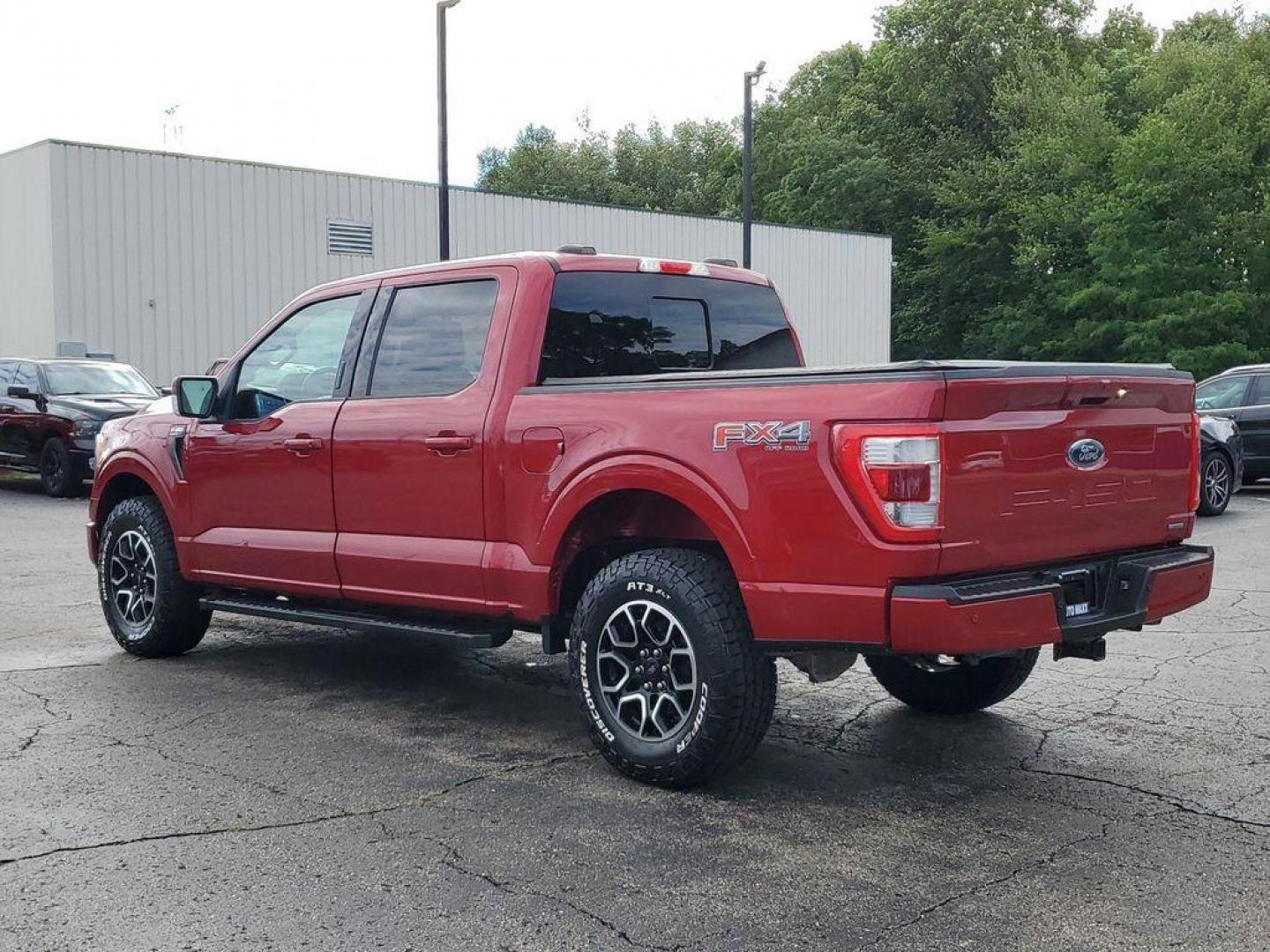 2021 Rapid Red Metallic Tinted Clearcoat /Black Ford F-150 Lariat SuperCrew 5.5-ft. Bed 4WD (1FTFW1E84MK) with an 4.6L V8 SOHC 24V engine, 10-speed automatic transmission, located at 234 Columbia Ave, Battle Creek, MI, 49015, (269) 222-0088, 42.298264, -85.192543 - <b>Vehicle Details</b><br>Experience the perfect blend of power, luxury, and technology with this stunning pre-owned 2021 Ford F-150 LARIAT! This truck is built to impress, featuring a mighty V6, 3.5L engine that delivers robust performance whether you're on the highway or tackling rugged terrain. T - Photo#2