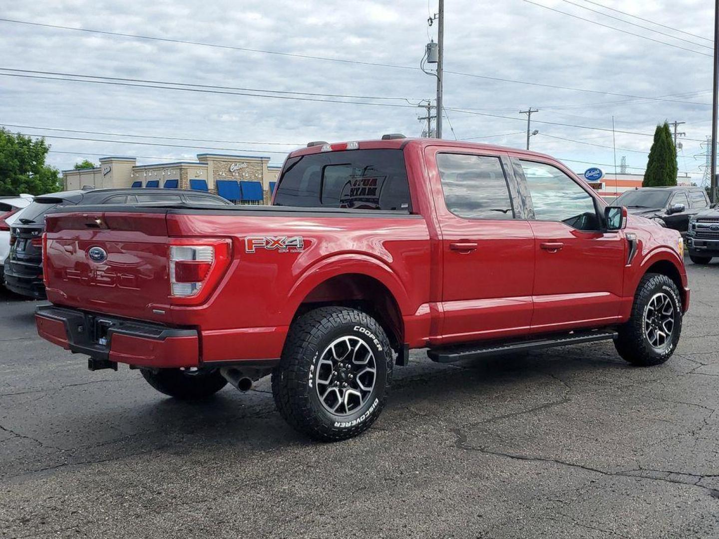 2021 Rapid Red Metallic Tinted Clearcoat /Black Ford F-150 Lariat SuperCrew 5.5-ft. Bed 4WD (1FTFW1E84MK) with an 4.6L V8 SOHC 24V engine, 10-speed automatic transmission, located at 234 Columbia Ave, Battle Creek, MI, 49015, (269) 222-0088, 42.298264, -85.192543 - <b>Vehicle Details</b><br>Experience the perfect blend of power, luxury, and technology with this stunning pre-owned 2021 Ford F-150 LARIAT! This truck is built to impress, featuring a mighty V6, 3.5L engine that delivers robust performance whether you're on the highway or tackling rugged terrain. T - Photo#3