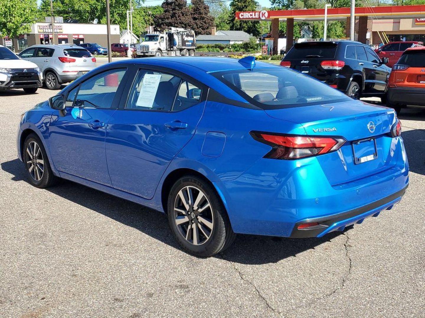 2021 Electric Blue Metallic /Graphite Nissan Versa SV (3N1CN8EV4ML) with an 1.6L L4 DOHC 16V engine, CVT transmission, located at 234 Columbia Ave, Battle Creek, MI, 49015, (269) 222-0088, 42.298264, -85.192543 - <b>Vehicle Details</b><br>Step into the drivers seat of the sleek and reliable 2021 Nissan Versa SV, a vehicle that combines practicality with pleasure to deliver an exceptional driving experience. This model comes with front-wheel drive and a robust L4, 1.6L engine that promises a smooth and fuel-e - Photo#2