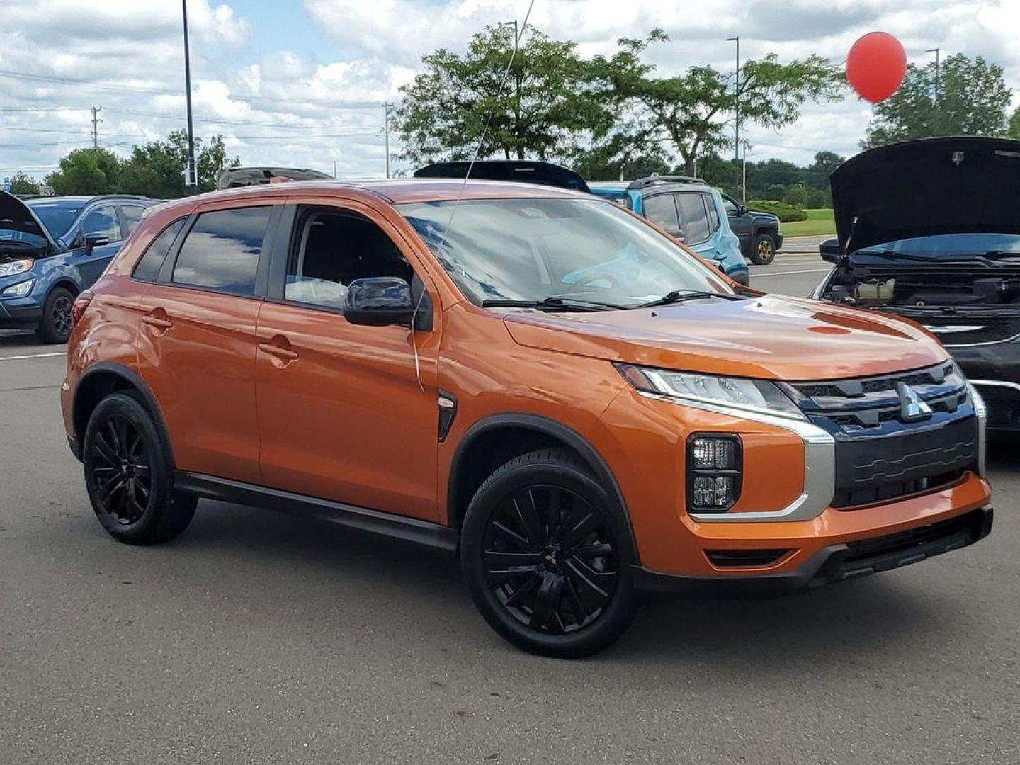 2022 Orange Sunrise Metallic /Black Mitsubishi Outlander Sport 2.0 ES CVT (JA4APUAU3NU) with an 2.0L L4 DOHC 16V engine, CVT transmission, located at 234 Columbia Ave, Battle Creek, MI, 49015, (269) 222-0088, 42.298264, -85.192543 - Discover the impressive 2022 Mitsubishi Outlander Sport LE, a versatile and stylish compact SUV that combines performance with modern conveniences. This well-maintained vehicle boasts 31,233 miles and features a robust L4, 2.0L engine paired with Front-Wheel Drive (FWD), ensuring a smooth and respon - Photo#0