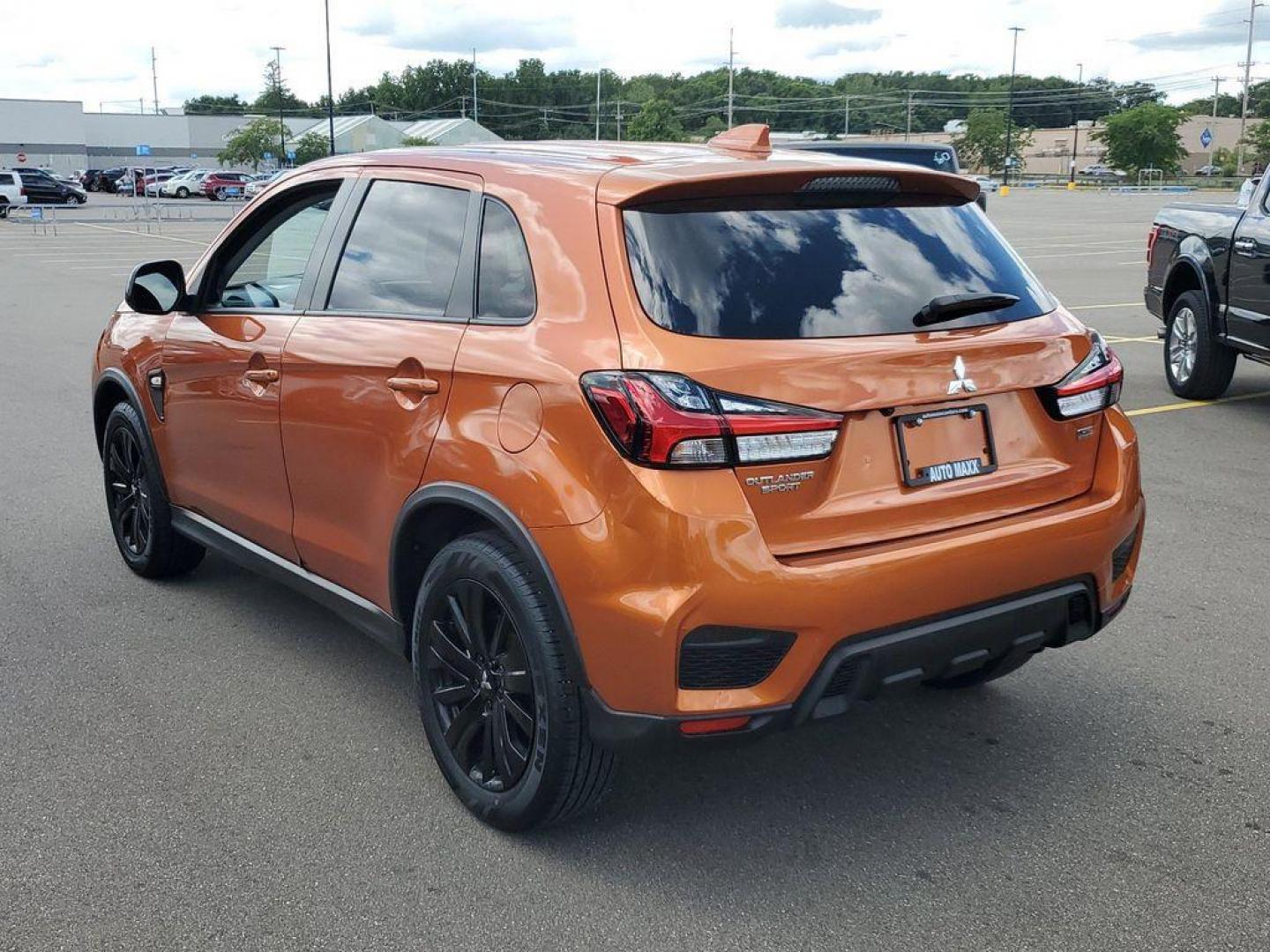 2022 Orange Sunrise Metallic /Black Mitsubishi Outlander Sport 2.0 ES CVT (JA4APUAU3NU) with an 2.0L L4 DOHC 16V engine, CVT transmission, located at 234 Columbia Ave, Battle Creek, MI, 49015, (269) 222-0088, 42.298264, -85.192543 - Discover the impressive 2022 Mitsubishi Outlander Sport LE, a versatile and stylish compact SUV that combines performance with modern conveniences. This well-maintained vehicle boasts 31,233 miles and features a robust L4, 2.0L engine paired with Front-Wheel Drive (FWD), ensuring a smooth and respon - Photo#2