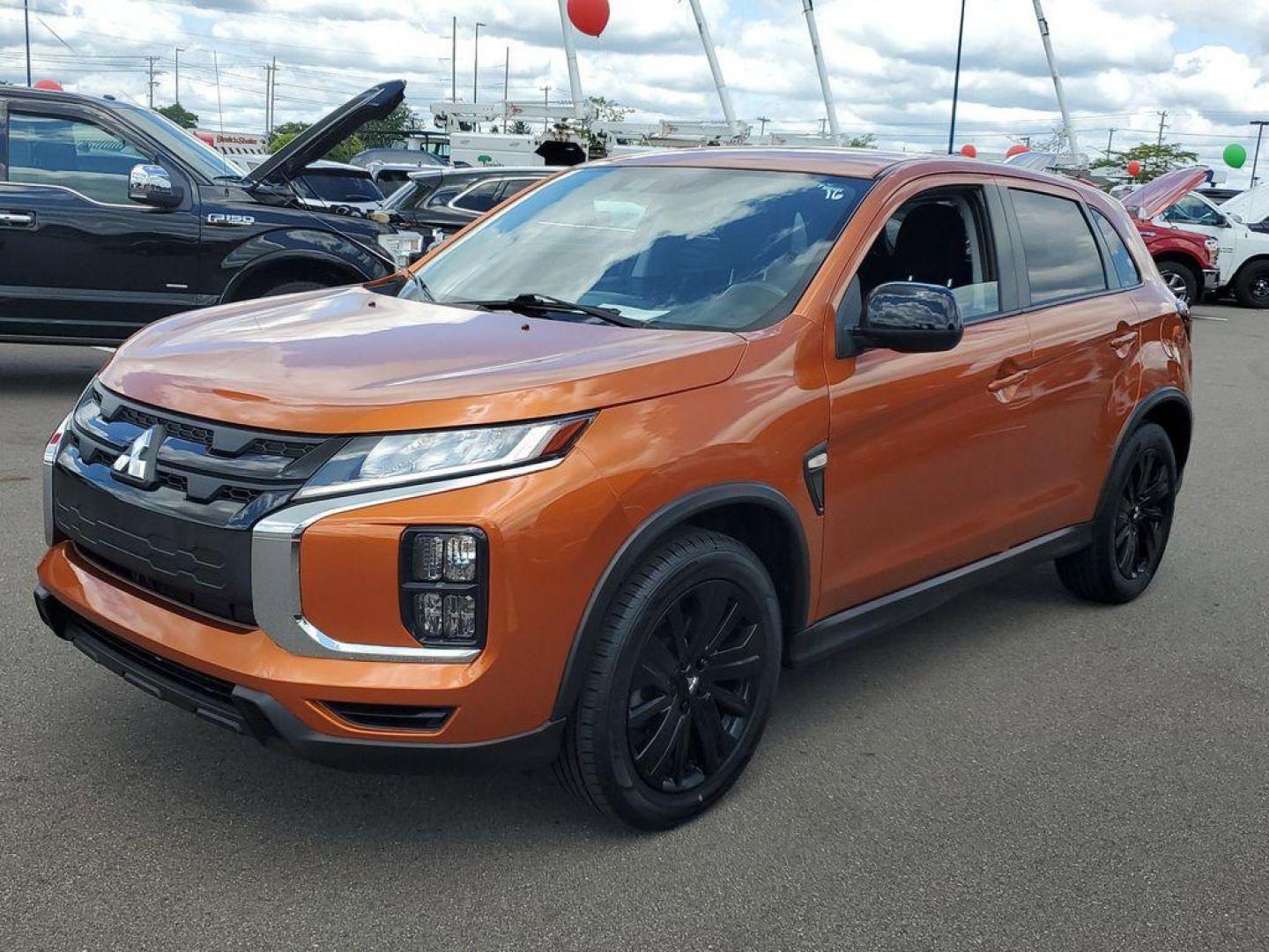 2022 Orange Sunrise Metallic /Black Mitsubishi Outlander Sport 2.0 ES CVT (JA4APUAU3NU) with an 2.0L L4 DOHC 16V engine, CVT transmission, located at 234 Columbia Ave, Battle Creek, MI, 49015, (269) 222-0088, 42.298264, -85.192543 - Discover the impressive 2022 Mitsubishi Outlander Sport LE, a versatile and stylish compact SUV that combines performance with modern conveniences. This well-maintained vehicle boasts 31,233 miles and features a robust L4, 2.0L engine paired with Front-Wheel Drive (FWD), ensuring a smooth and respon - Photo#3