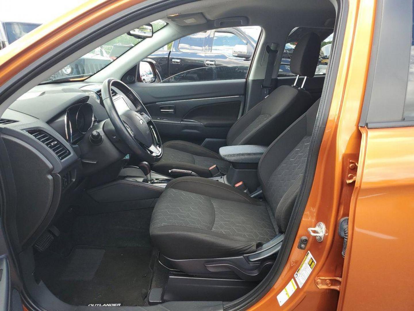 2022 Orange Sunrise Metallic /Black Mitsubishi Outlander Sport 2.0 ES CVT (JA4APUAU3NU) with an 2.0L L4 DOHC 16V engine, CVT transmission, located at 234 Columbia Ave, Battle Creek, MI, 49015, (269) 222-0088, 42.298264, -85.192543 - Discover the impressive 2022 Mitsubishi Outlander Sport LE, a versatile and stylish compact SUV that combines performance with modern conveniences. This well-maintained vehicle boasts 31,233 miles and features a robust L4, 2.0L engine paired with Front-Wheel Drive (FWD), ensuring a smooth and respon - Photo#7